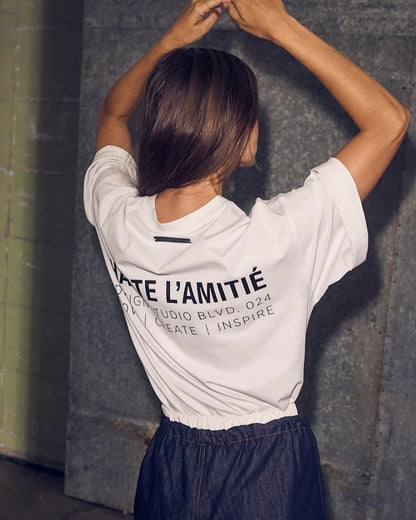 Haute L'amitié Back Logo Loose T-Shirt